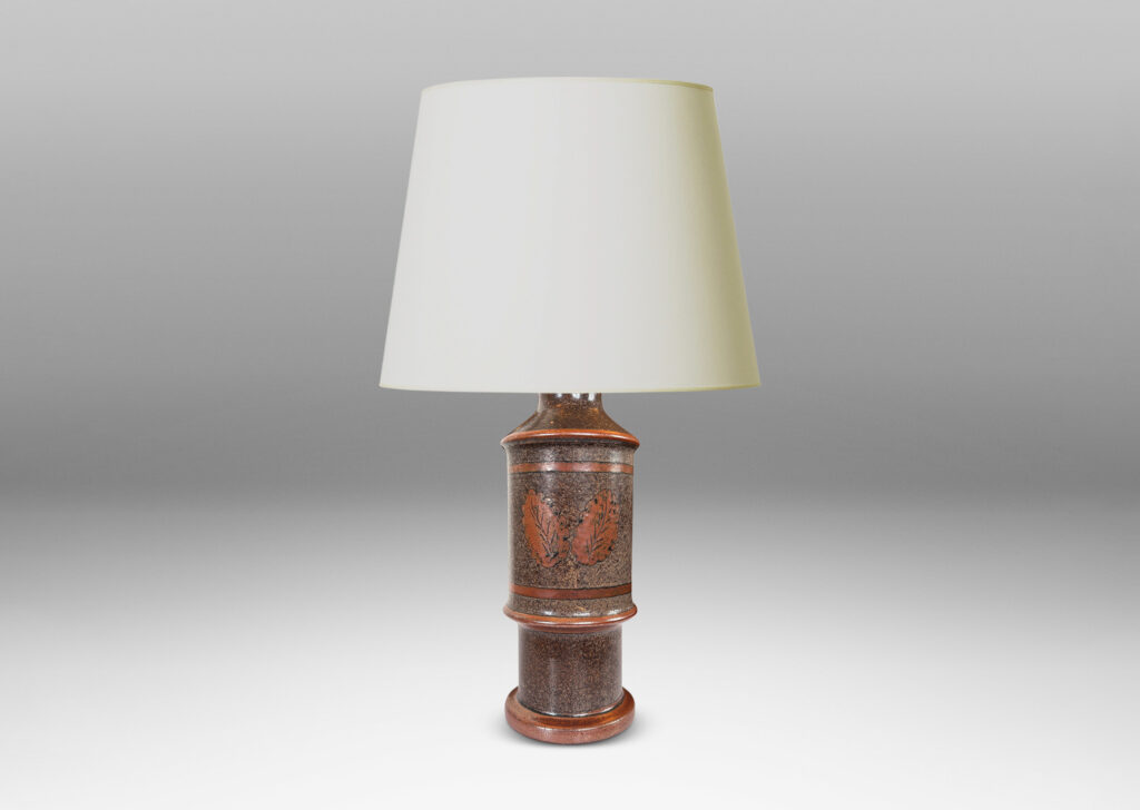 Gallery BAC tiered cylindrical form with notched accents, glazed in sponged dark over medium brown