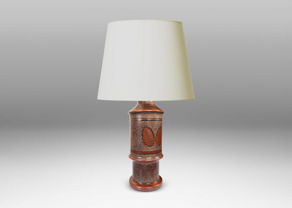 Gallery BAC tiered cylindrical form with notched accents, glazed in sponged dark over medium brown