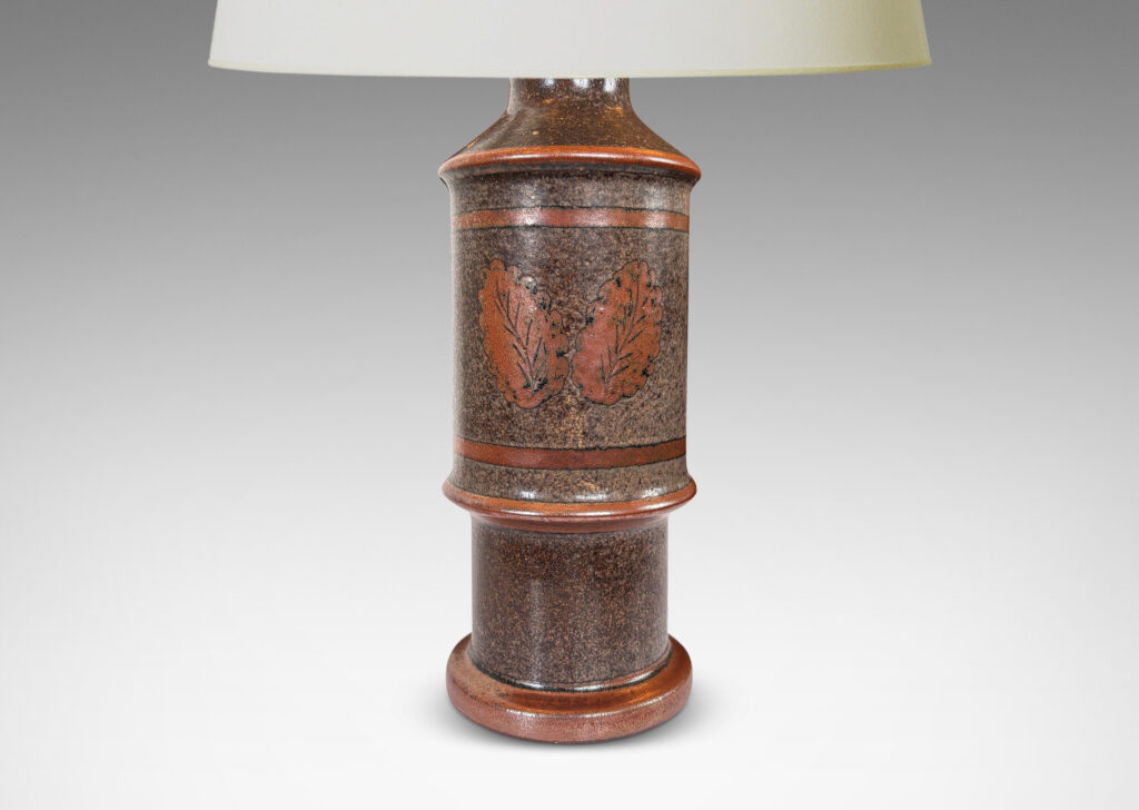 Gallery BAC tiered cylindrical form with notched accents, glazed in sponged dark over medium brown
