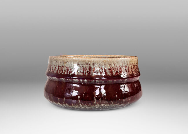 Gallery BAC organically modeled form glazed in oxblood burgundy, with dark and pale gray