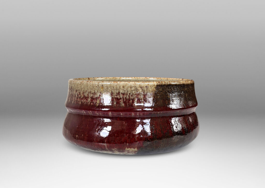 Gallery BAC organically modeled form glazed in oxblood burgundy, with dark and pale gray