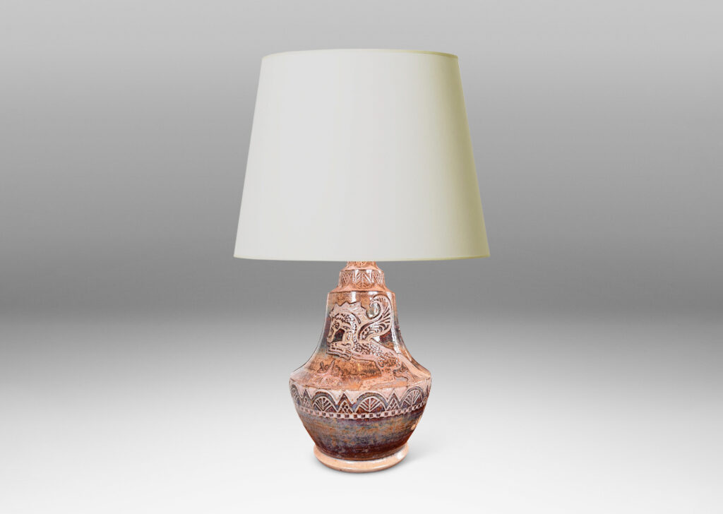 Gallery BAC carved bands of geometric foliate forms, a winged horse / Pegasus, and starbursts, glazed in puce-tan and purple-brown