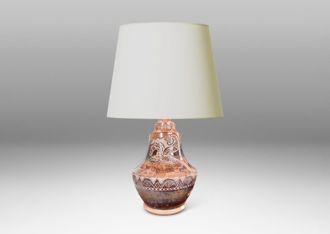 Gallery BAC carved bands of geometric foliate forms, a winged horse / Pegasus, and starbursts, glazed in puce-tan and purple-brown