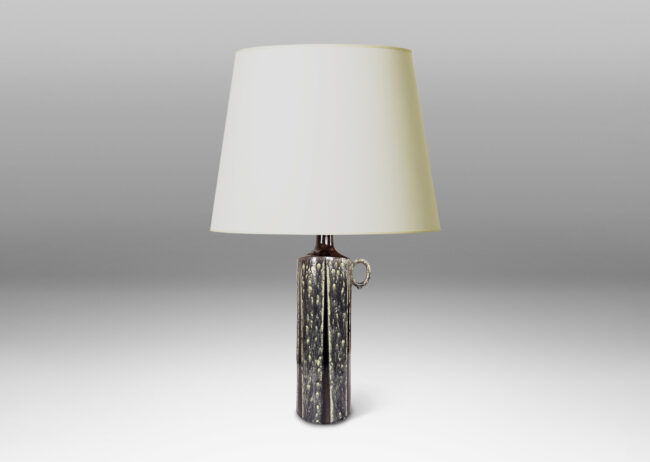 Gallery BAC cylindrical form, with ring handle and spouting mouth, glazed in flowing black-pale celadon