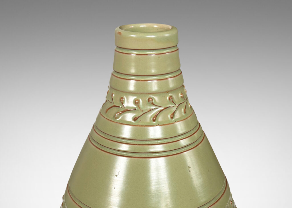 Gallery BAC tall swelling form with carved stripes and ornamental foliate bands, glazed in a pale celadon