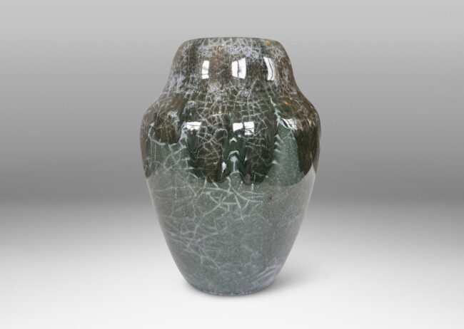 Gallery BAC ginger jar style form, glazed in a shiny jade green, with flowing dark jungle green and pale gray-blue craquel patterning