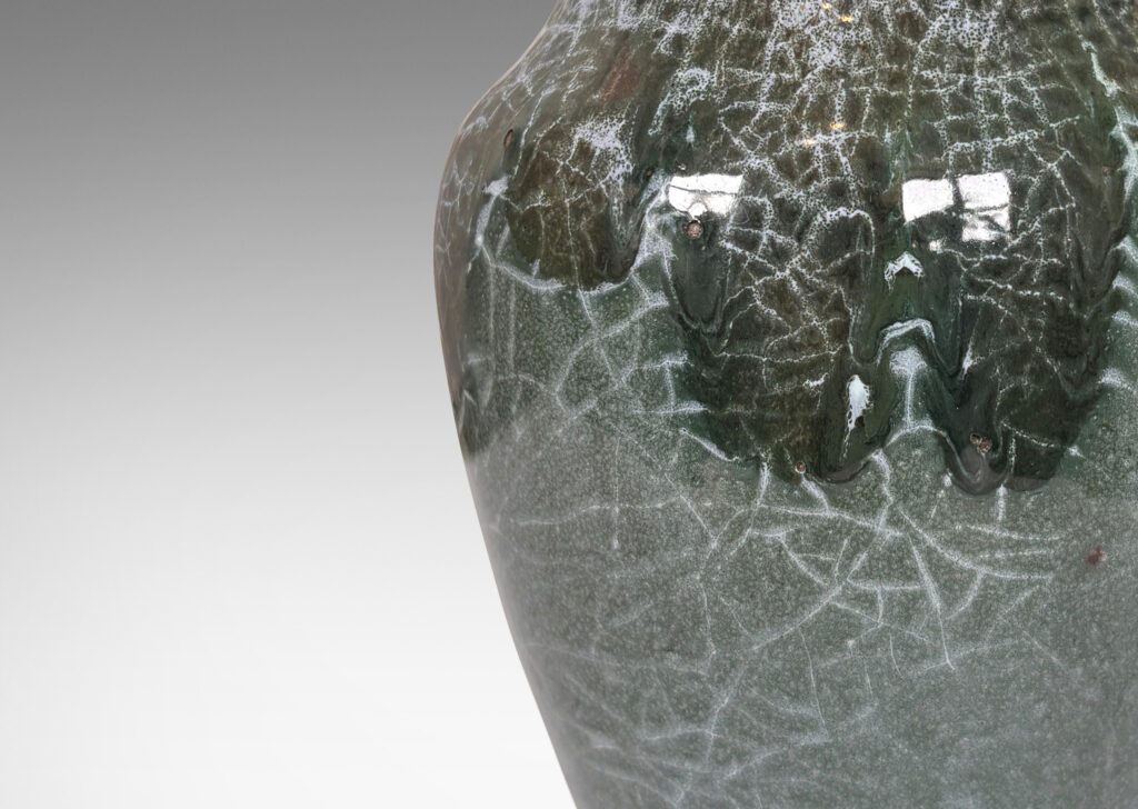 Gallery BAC ginger jar style form, glazed in a shiny jade green, with flowing dark jungle green and pale gray-blue craquel patterning