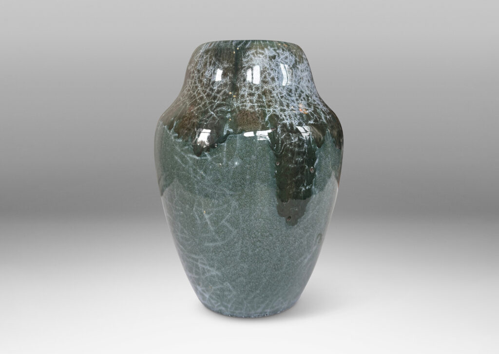 Gallery BAC ginger jar style form, glazed in a shiny jade green, with flowing dark jungle green and pale gray-blue craquel patterning