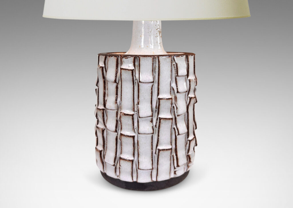 Gallery BAC cylindrical form with bark-like texture from applied rectangular strips, partially glazed in a shiny white, with exposed dark brown