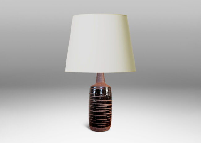 Gallery BAC cylindrical form in speckled brown ceramic partially overglazed with a striae effect thick glossy dark brown