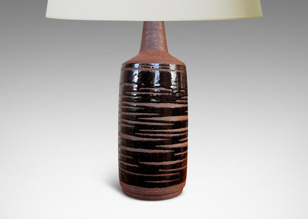 Gallery BAC cylindrical form in speckled brown ceramic partially overglazed with a striae effect thick glossy dark brown