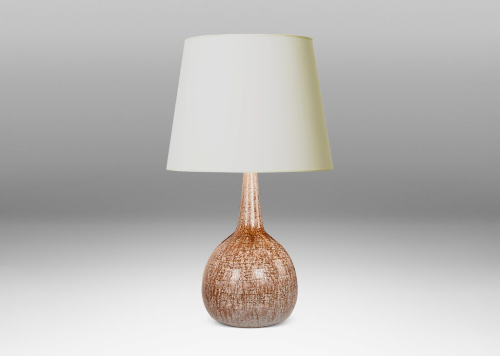 Gallery BAC bulbous form with tall, conical neck, glazed in pale beige over raw umber brown