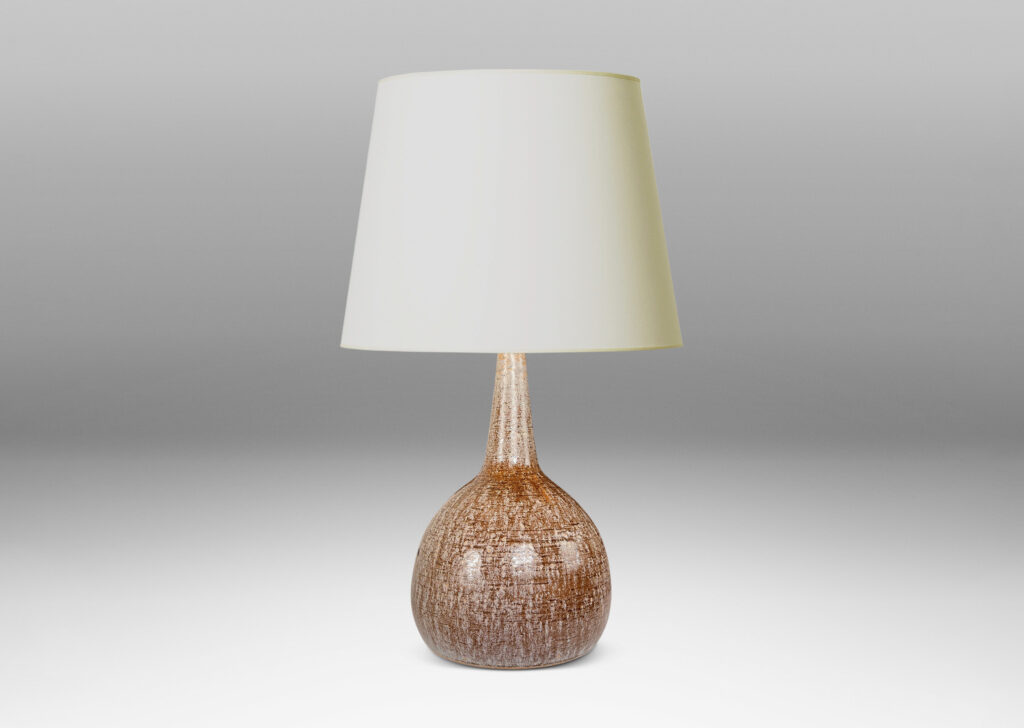Gallery BAC bulbous form with tall, conical neck, glazed in pale beige over raw umber brown