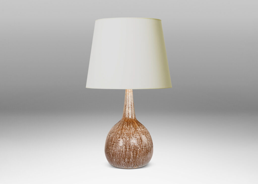Gallery BAC bulbous form with tall, conical neck, glazed in pale beige over raw umber brown