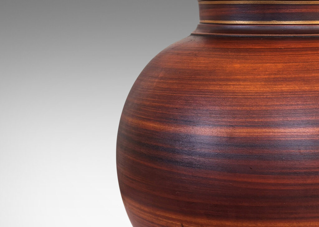 Gallery BAC globe forms with reveal and collar neck, glazed in a wonderful faux-bois striae brown with gilded accents