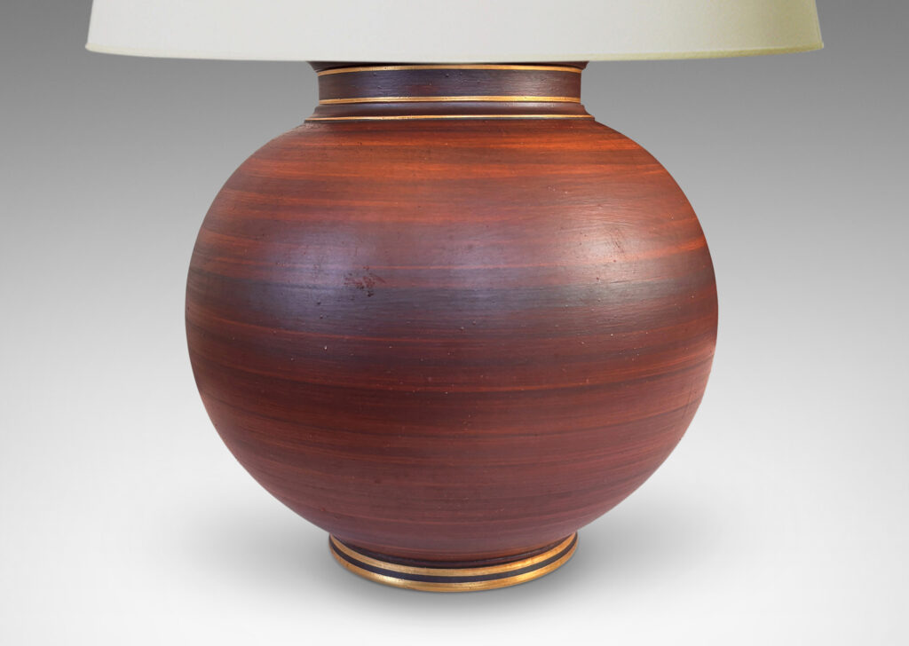 Gallery BAC globe forms with reveal and collar neck, glazed in a wonderful faux-bois striae brown with gilded accents