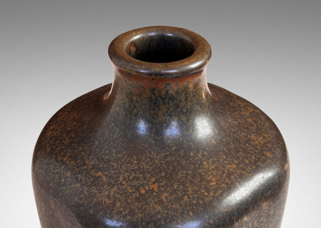 Gallery BAC organically modeled squared form with spout neck, glazed in a sponged green-brown, brown, and black