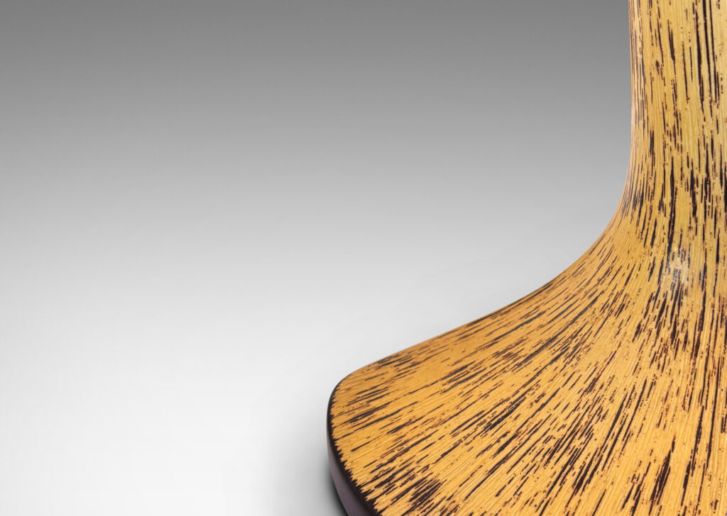 Gallery BAC smooth angled stand and a textured wedge base, glazed in black and yellow