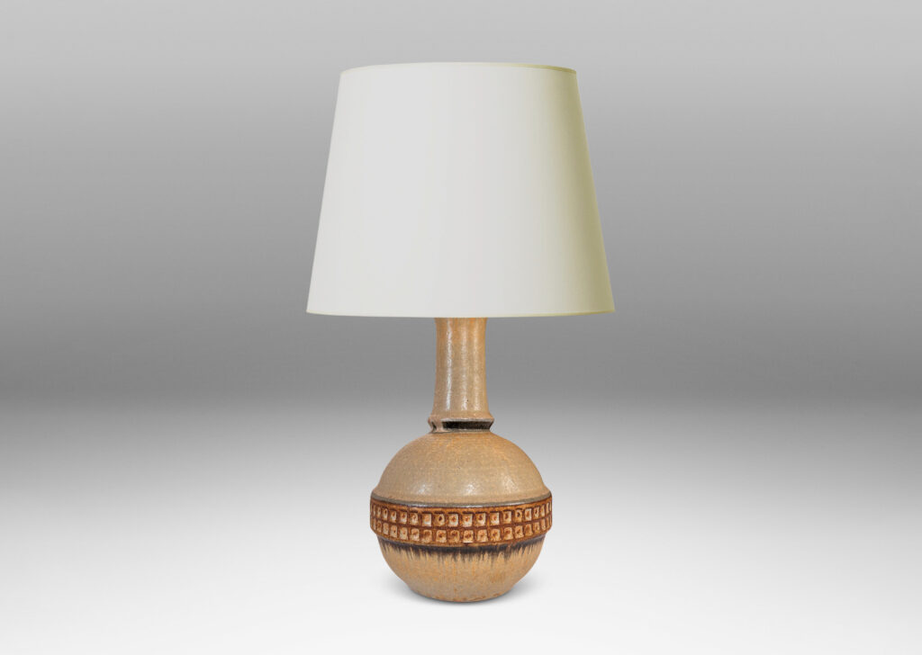 Gallery BAC globe form with notched neck and relief gridded band, glazed in pale beige with brown and gray accents