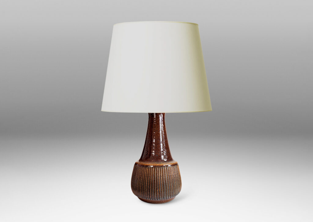 Gallery BAC bulbous form, with swelling ribbed bottom half and wide conical neck above, glazed in dark brown