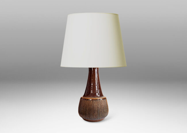 Gallery BAC bulbous form, with swelling ribbed bottom half and wide conical neck above, glazed in dark brown