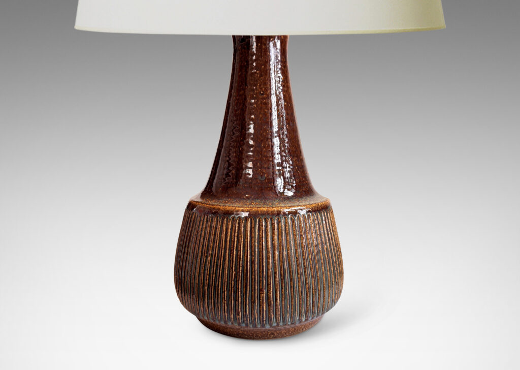 Gallery BAC bulbous form, with swelling ribbed bottom half and wide conical neck above, glazed in dark brown
