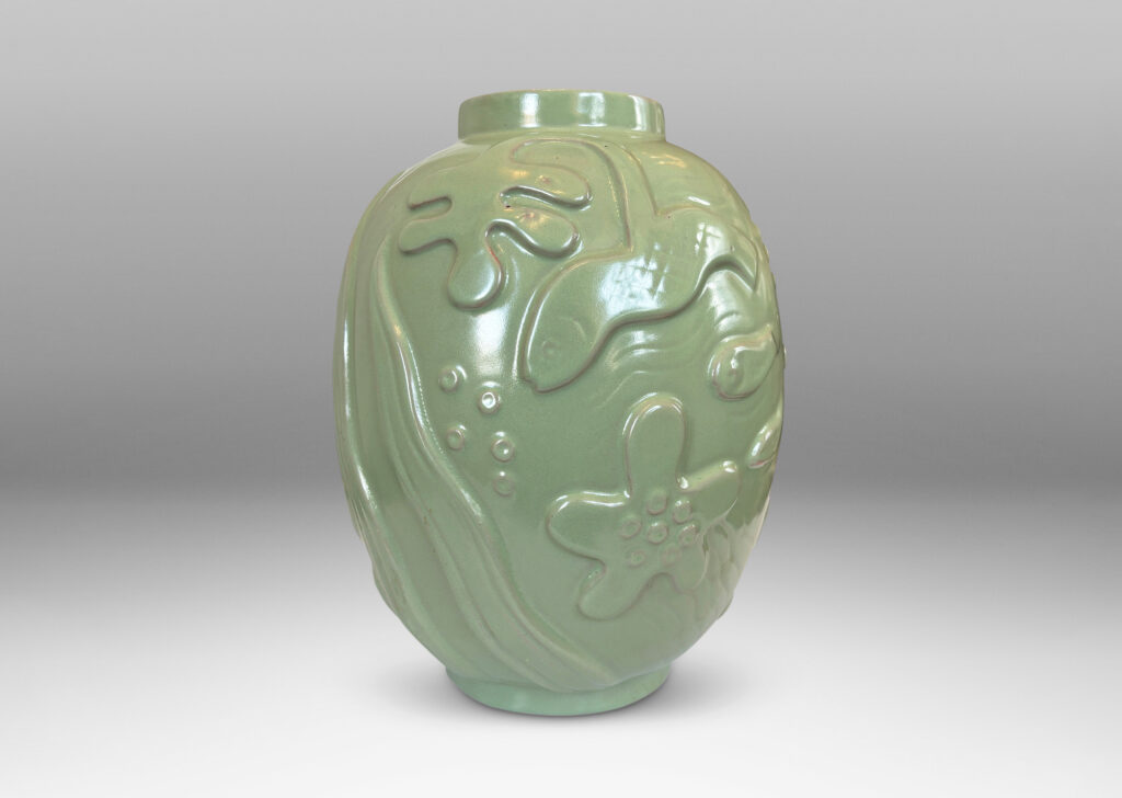 Gallery BAC large ovoid form surrounded in exuberant reliefs of marine life, glazed in a bright celadon green