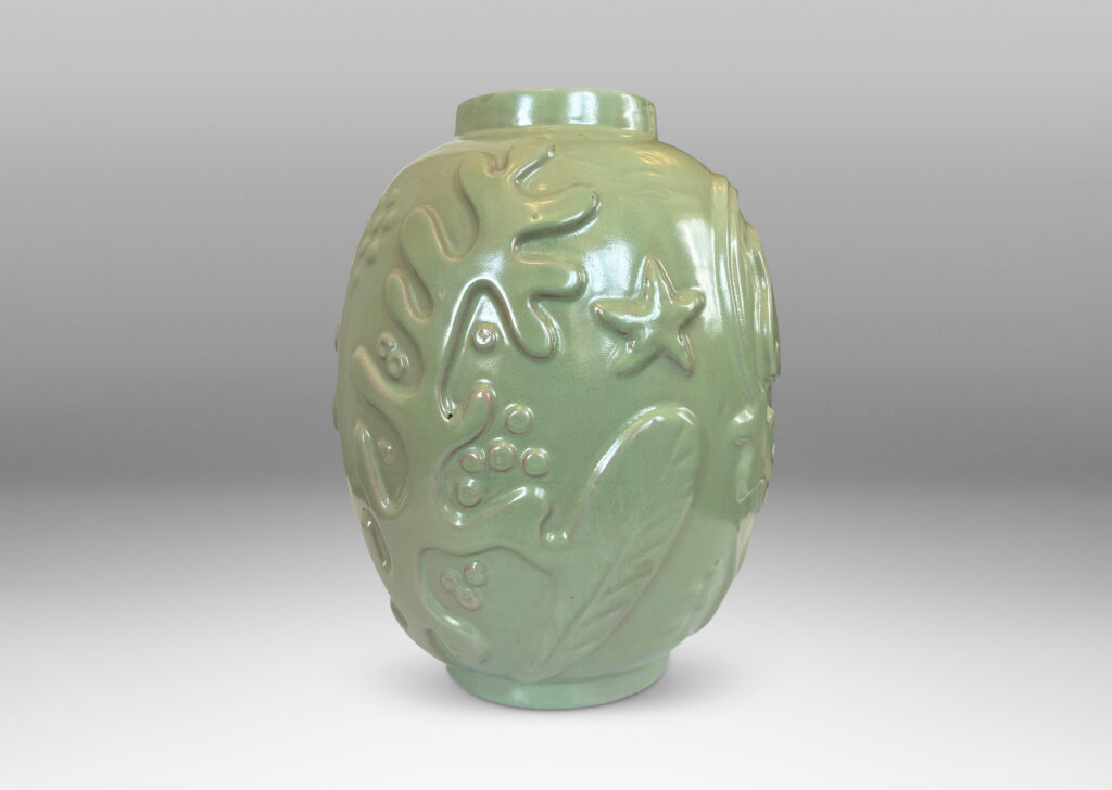 Gallery BAC large ovoid form surrounded in exuberant reliefs of marine life, glazed in a bright celadon green