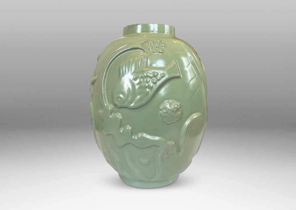 Gallery BAC large ovoid form surrounded in exuberant reliefs of marine life, glazed in a bright celadon green