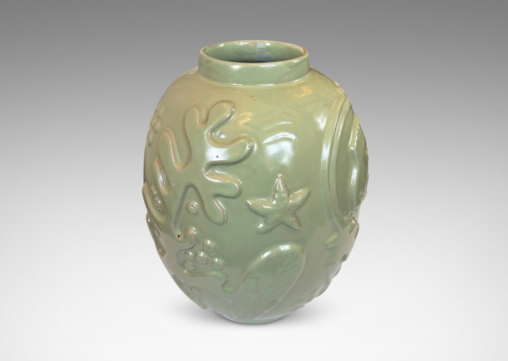 Gallery BAC large ovoid form surrounded in exuberant reliefs of marine life, glazed in a bright celadon green