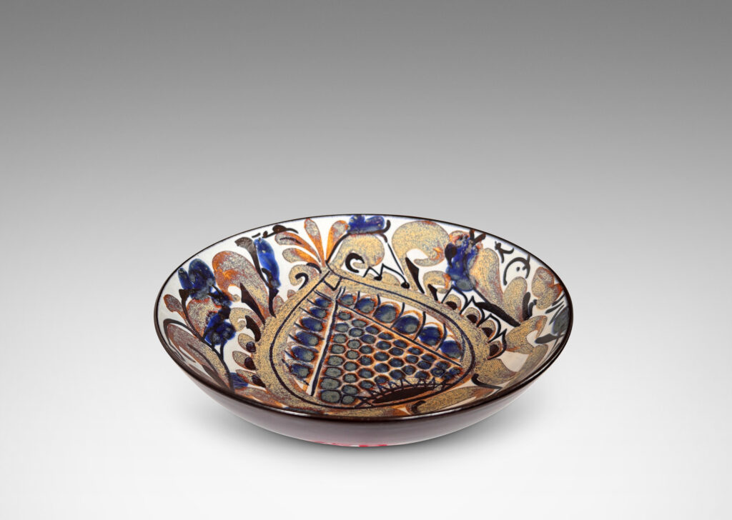 Gallery BAC simple arced sides, glazed inside with a rich paisley pattern in brown and blue luster with dark blue, over a pale gray-white, with dark blue exterior