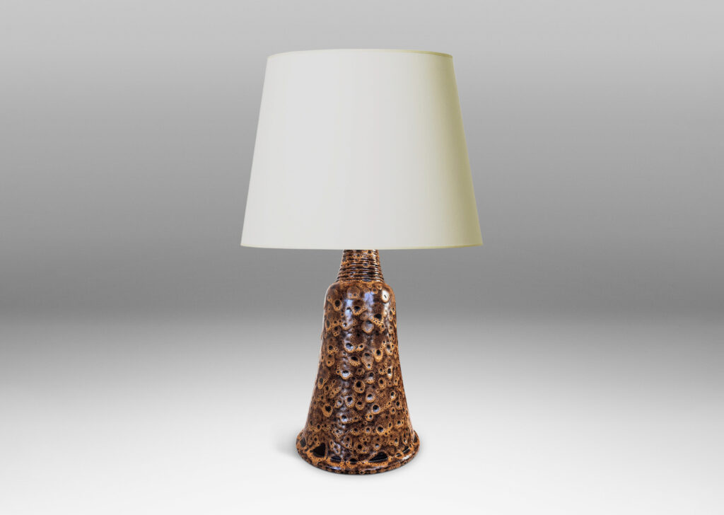 Gallery BAC bell form with ridged neck, glazed in a dark brown with frothy tan “lava” texture