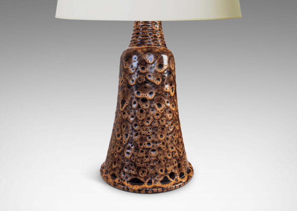 Gallery BAC bell form with ridged neck, glazed in a dark brown with frothy tan “lava” texture