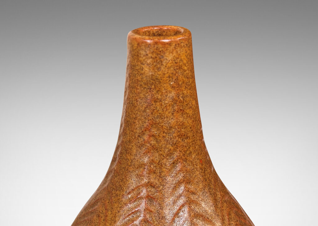 Gallery BAC drop form with slender sprouting neck and carved herringbone pattern, glazed in speckled sandy tan tones