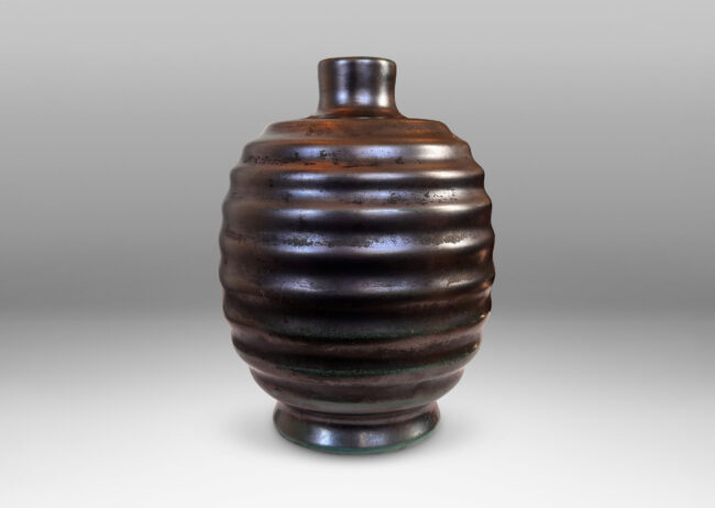 Gallery BAC ovoid form with sculptural horizontal ridging, glazed in a lustrous tonal teal-gunmetal