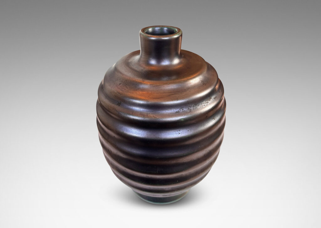 Gallery BAC ovoid form with sculptural horizontal ridging, glazed in a lustrous tonal teal-gunmetal