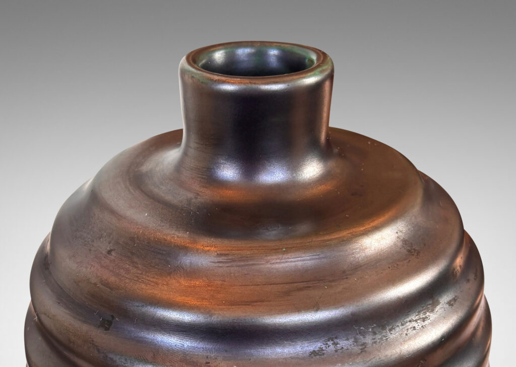 Gallery BAC ovoid form with sculptural horizontal ridging, glazed in a lustrous tonal teal-gunmetal