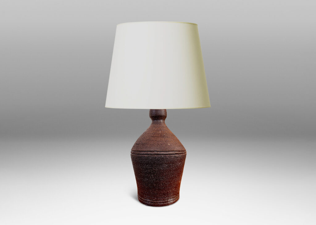 Gallery BAC angled form with banded edges and turning textures, with a matte dark brown finish