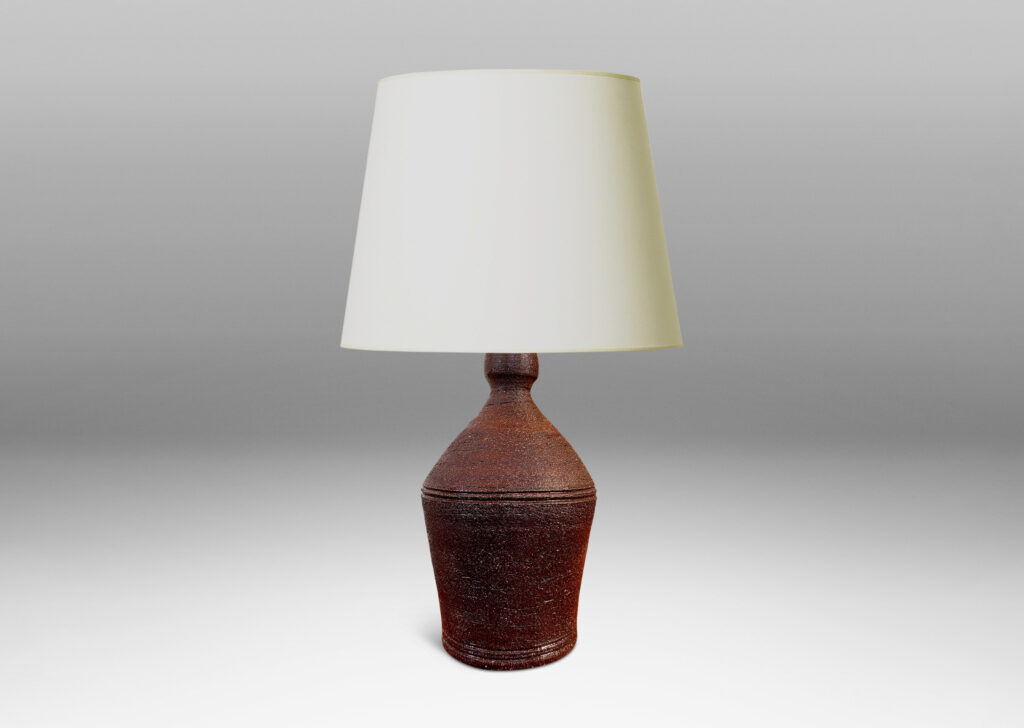 Gallery BAC angled form with banded edges and turning textures, with a matte dark brown finish