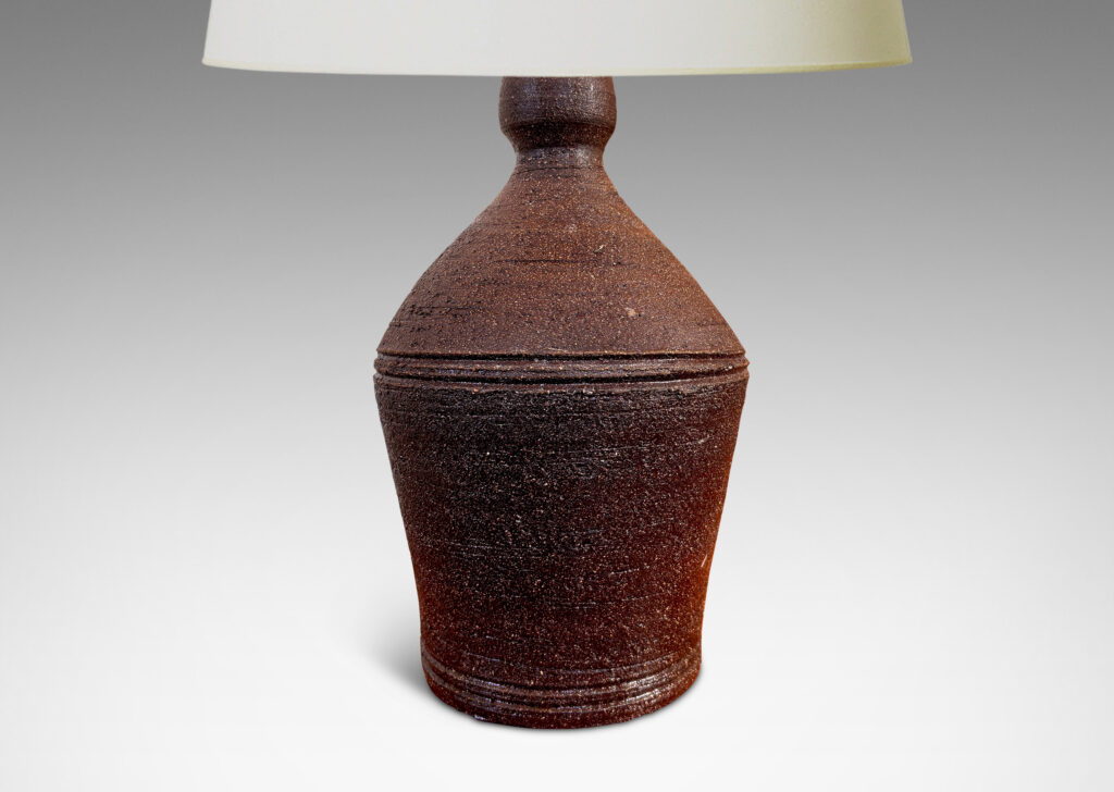 Gallery BAC angled form with banded edges and turning textures, with a matte dark brown finish