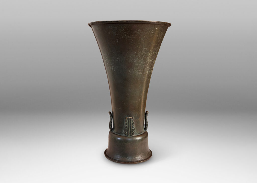 Gallery BAC flared trumpet form on a bell-shaped stand, with applied stylized acanthus leaf ornaments and a handsome original patination with green and brown tones