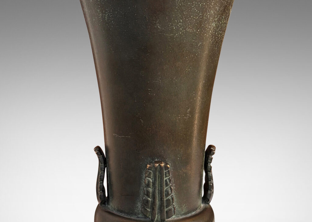 Gallery BAC flared trumpet form on a bell-shaped stand, with applied stylized acanthus leaf ornaments and a handsome original patination with green and brown tones