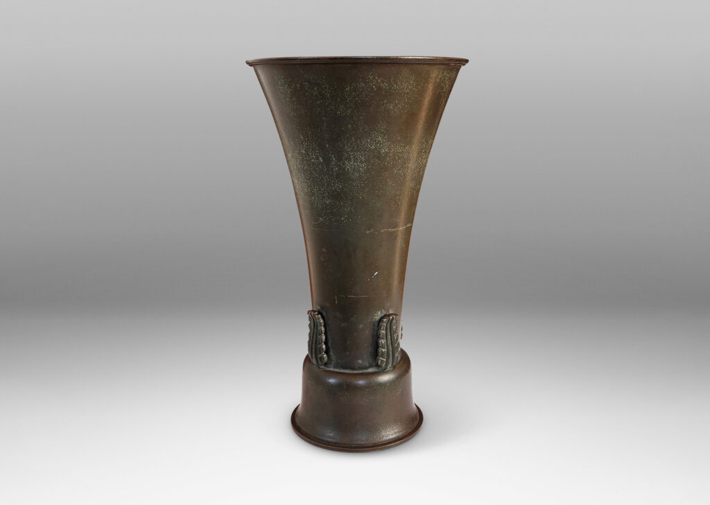 Gallery BAC flared trumpet form on a bell-shaped stand, with applied stylized acanthus leaf ornaments and a handsome original patination with green and brown tones