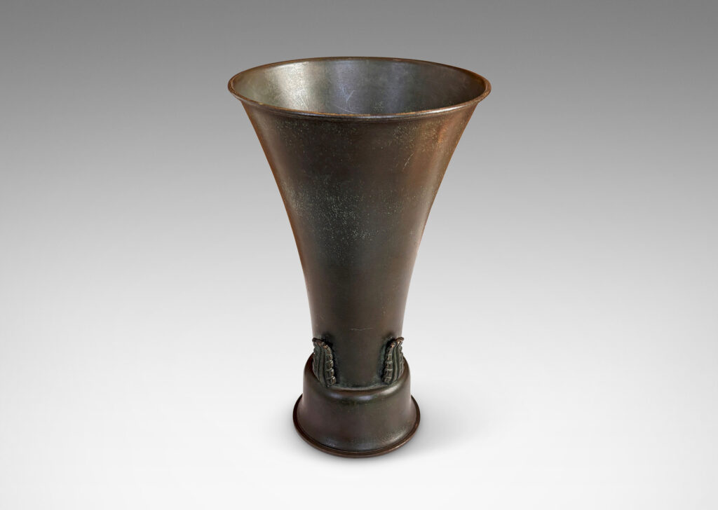 Gallery BAC flared trumpet form on a bell-shaped stand, with applied stylized acanthus leaf ornaments and a handsome original patination with green and brown tones