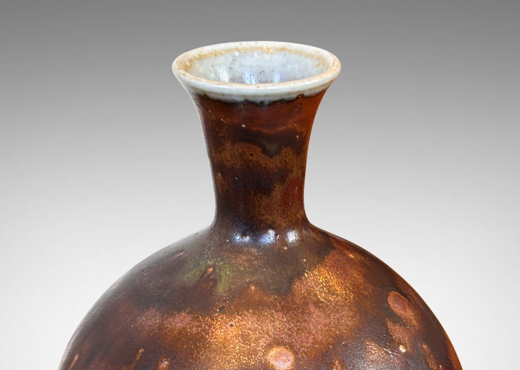 Gallery BAC tapered form with trumpeting neck, glazed in flowing brown luster, with hints of light taupe