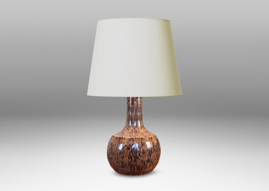 Gallery BAC plump globe form with sprouting neck and caoved shoulders, glazed in a tortoise shell evoking semi-shine mottled black over tan