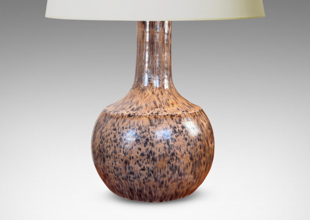 Gallery BAC plump globe form with sprouting neck and caoved shoulders, glazed in a tortoise shell evoking semi-shine mottled black over tan
