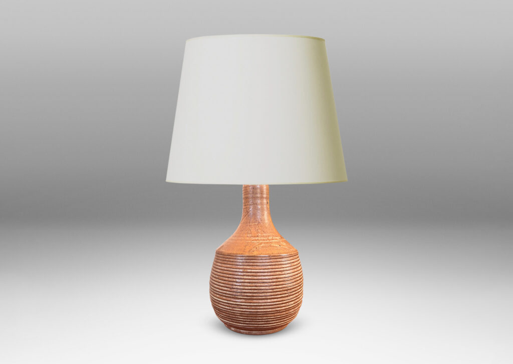Gallery BAC jug-like form with ridged bulging body and smooth sprouting neck, glazed in light brown-pale taupe