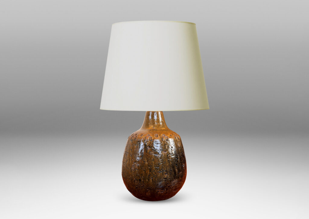 Gallery BAC plump ovoid form with grog texture and geometric motifs impressed around shoulder, glazed in olive brown