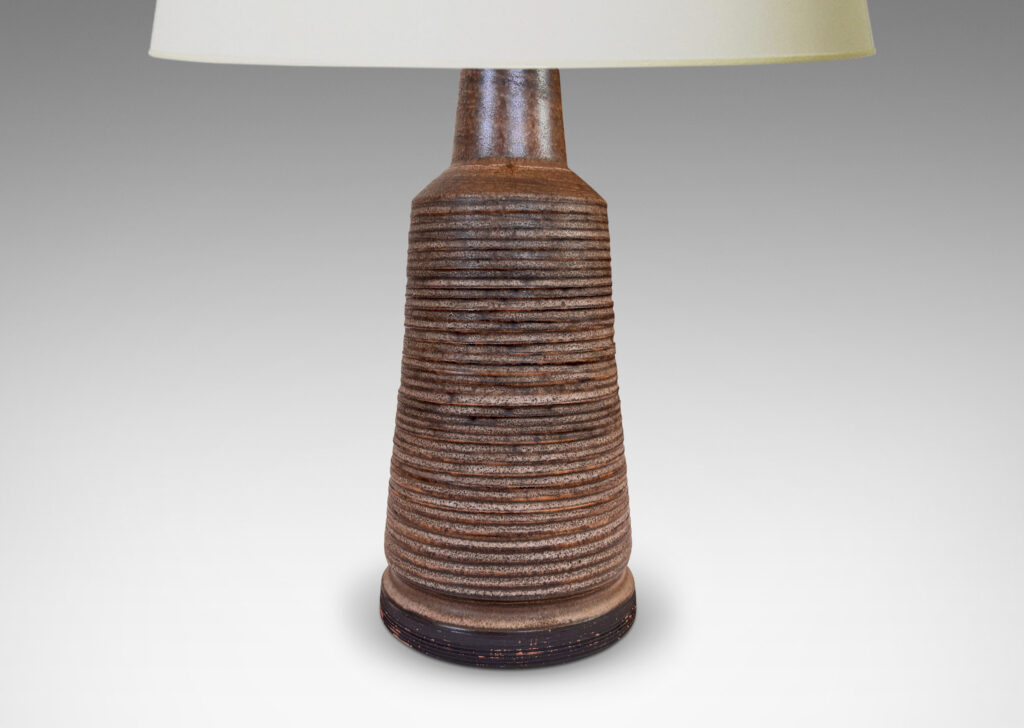 Gallery BAC flared cylindrical form with ridged texture and brushed articulated foot, glazed in matte dark brown